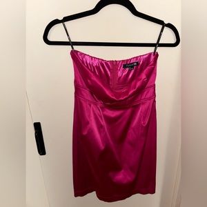 A satin, pink strapless sweetheart neckline with concealed zipper in back.